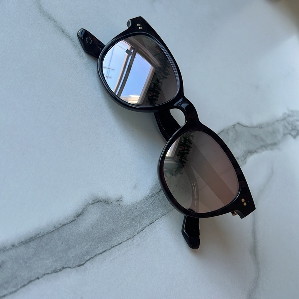 KREWE Black Minimalist Sunglasses with Retro Flair